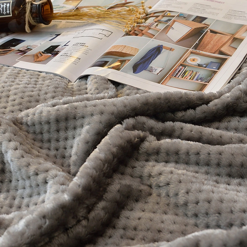 Super Soft and Breathable Coral Fleece Blanket with Honeycomb Design.